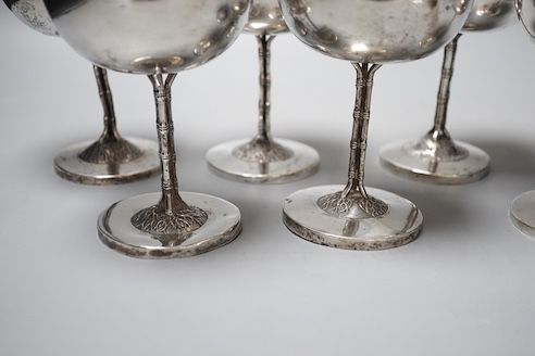 A set of six early 20th century Chinese Export white metal goblets, by Luen Wo, Shanghai, with faux bamboo stems, height 11.9cm, 29oz, (heights differ).